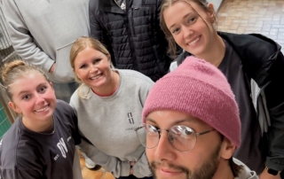Tailwind Group employees doing volunteer work in the community for a local animal shelter
